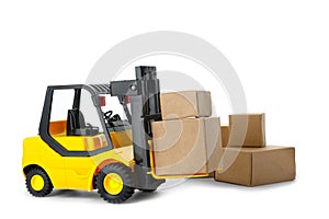 Toy forklift with boxes isolated. Logistics and wholesale concept