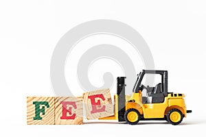 Toy forklift hold letter block e to complete word fee on white background