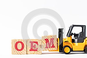 Toy forklift hold wood block M to complete word OEM Abbbreviation of Original Equipment Manufacturer on white background