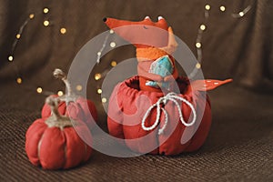 Toy fox and handmade pumpkins. House decor, cozy handmade toys. Thankgiving or Christmas gift concept