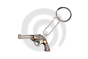 Toy gun with key chain on white background