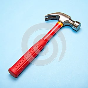 Toy hammer on a blue background