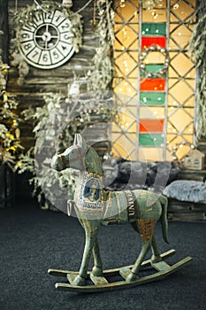Toy horse and clock in vintage christmas decorated room