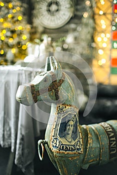 Toy horse and tree balls in vintage christmas decorated room