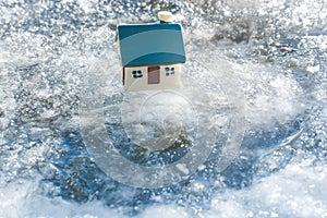 Toy house on ice