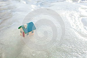 Toy house on ice