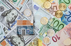 Toy house on many euro and dollar banknotes and euro coins