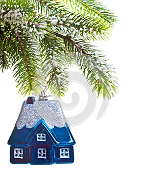 Toy house on a New Year's tree-dream about house