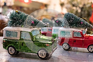 Toy jeeps with Christmas trees on roof, photographed at VV Rouleaux haberdashery shop, Marylebone Lane, London, UK.