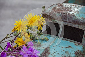 toy metal machine with traces of corrosion is on the concrete. Rust on the machine's gland