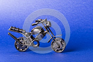 toy model of a sports motorcycle on a blue background