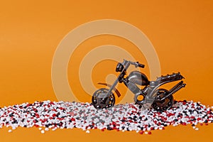 toy model of a sports motorcycle on an orange background
