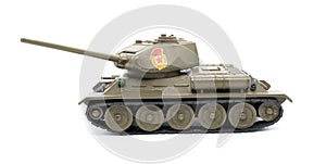 Toy model of a tank from the USSR made of metal on a white background, isolated object