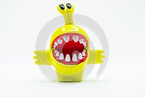 Toy monster with high eyes on white background