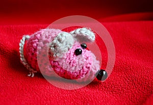 Toy mouse knitted by a child