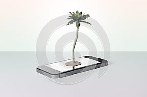 Toy palm tree on a smart phone