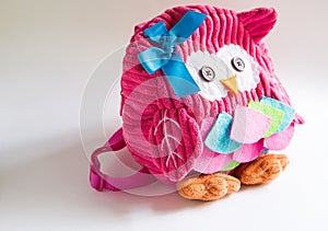 Toy pink backpack for girls in the shape of an owl with eyes buttons, applique, ribbon and embroidery. Handmade, DIY with children