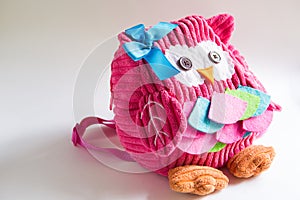 Toy pink backpack for girls in the shape of an owl with eyes buttons, applique, ribbon and embroidery. Handmade, DIY with children