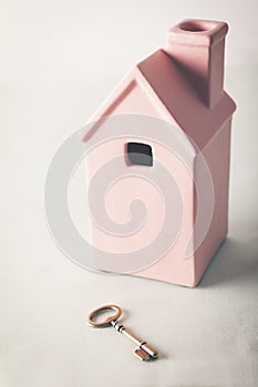 Toy pink house with gold key