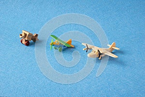Toy planes retro on blue background. Set of vintage models of airplanes in miniature.