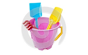 Toy plastic bucket with a shovel and a rake