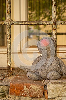 toy plush cat forgotten on the old window