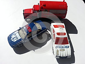 Toy police vehicles on white background