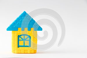 Toy puzzle connect as house shape on white background