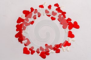Toy red hearts over white background. Valentines Day Symbols. Top view. Copy space