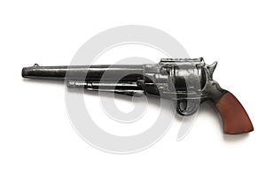 A toy replica of an old western cowboy Colt Winchester style black revolver with brown wood handle