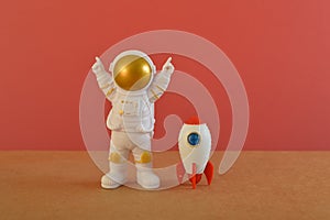 Toy rocket with astronaut. Space man, Kid dream flying, childhood, freedom, travel, future concept