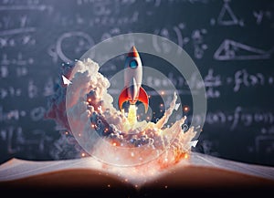 Toy rocket takes spewing smoke on a book in green blackboard background. The symbol for success is Start-up education and