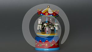 Toy rotating carousel with three white horses horse  music box