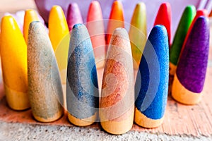 Toy set conical pieces of wood painted in colors for unstructured children`s games