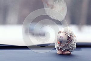 Toy sheep background at car