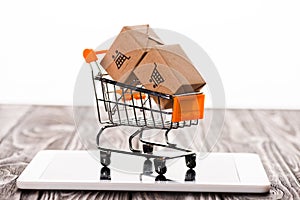 toy shopping cart with small carton