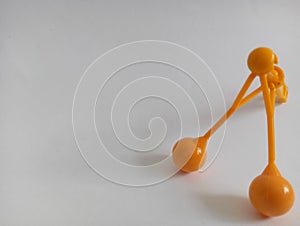 a toy with a small handle called lato lato has been around for a long time isolated on a white background