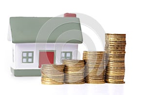 Toy small house and coins photo