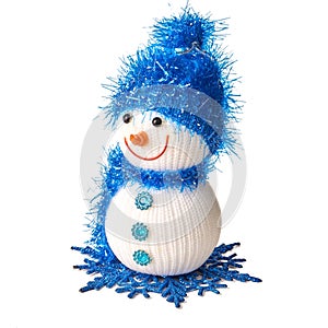Toy snowman in blue hat and scarf isolated on white background