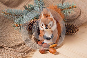 Toy squirrel under ther Christmas tree photo