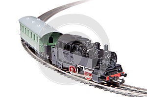 Toy steam train pulling one carriage