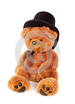 Toy teddy bear with black hat