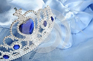 Toy tiara with diamonds and blue gem