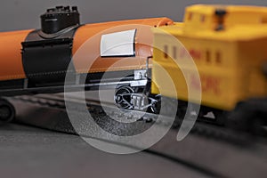 Toy train derailed, close-up. Concept: train wreck, train crash and accident.