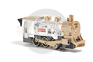 toy train with freight car trolley on railway tracks, isolated on white background, children's railway with steam