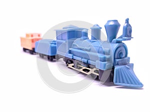 Toy train isolated on white background. Concept of childhood learning. Selective focus