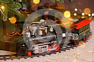 Toy train under Christmas tree