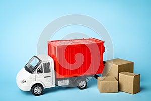 Toy truck with boxes on background, space for text. Logistics and wholesale concept