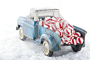 Toy truck carrying striped peppermint candy