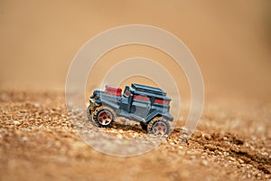 Toy truck offroading on mud with soft focus and beautiful bokeh photo